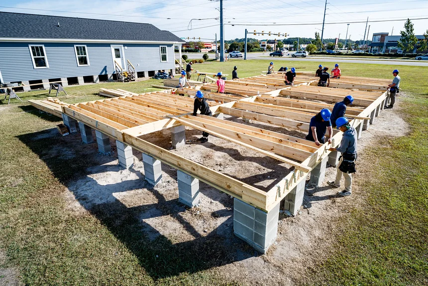 Deck joists resting on concrete pier blocks