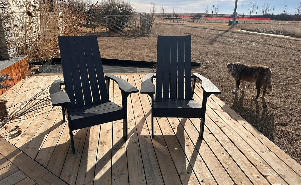 Two chairs standing on fresh timber decking
